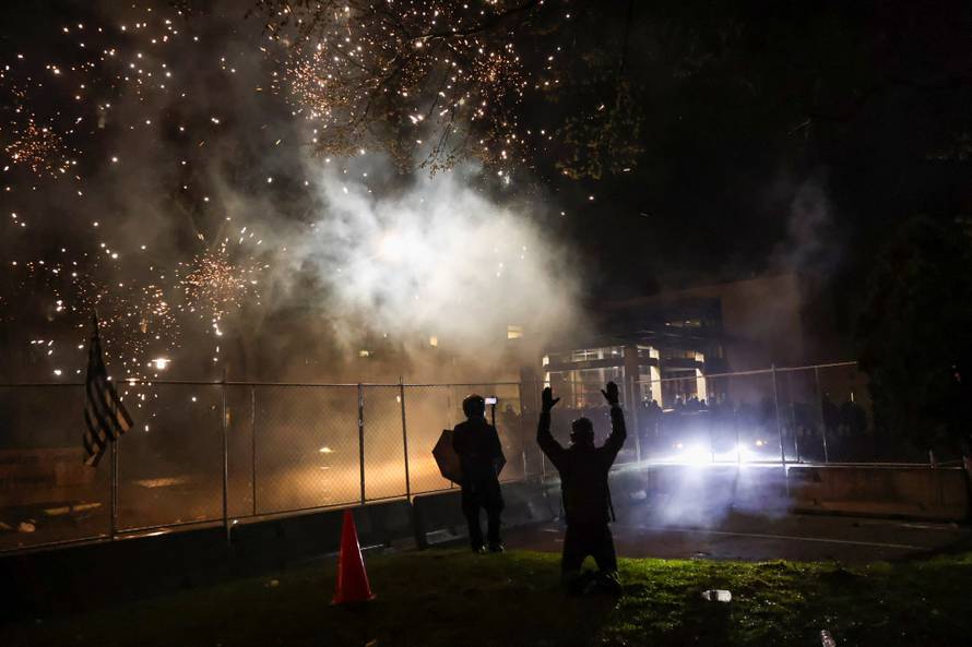 Protesters rally outside Brooklyn Center Police Department a day after Daunte Wright was shot and killed by a police officer, in Brooklyn Center, Minnesota