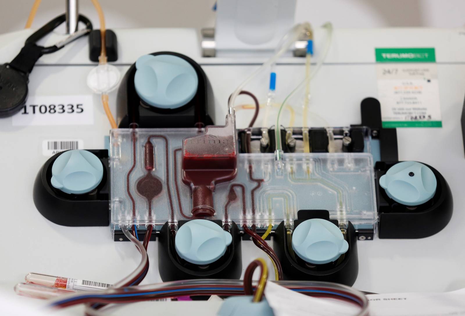 FILE PHOTO: An apheresis machine separates plasma from whole blood to collect convalescent plasma from a recovered coronavirus (COVID-19) patient for an experimental treatment study at Bloodworks Northwest in Seattle