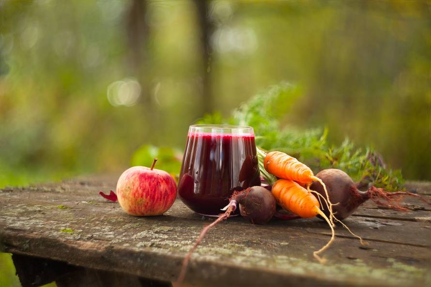 beet juice in glass on  table