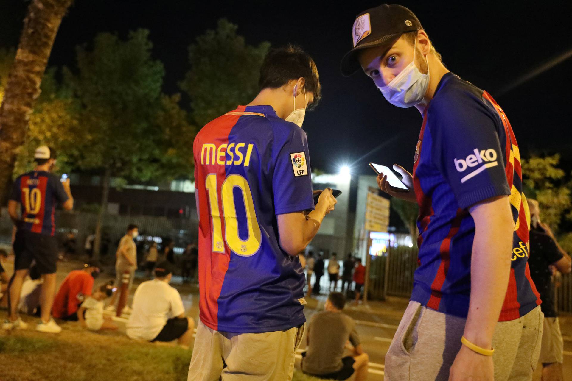 Barcelona fans are seen outside the Camp Nou after captain Lionel Messi told Barcelona he wishes to leave the club immediately