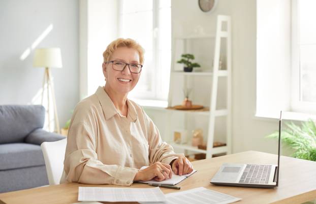 Portrait,Of,An,Elderly,Woman,Working,Online,From,A,Home