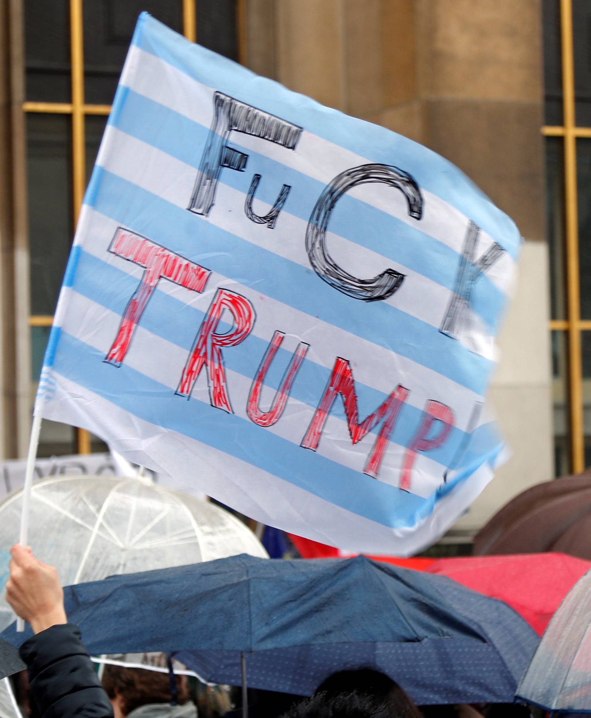 People gather at the Trocadero square to protest against U.S. President Donald Trump and for equal rights in Paris