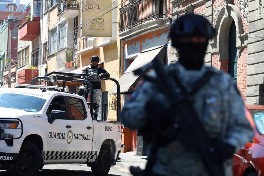 Members of the National Guard stand guard outside the Specialized Prosecutor's Office for Organized Crime (FEMDO) following the killing of 'El Mencho', in Mexico City