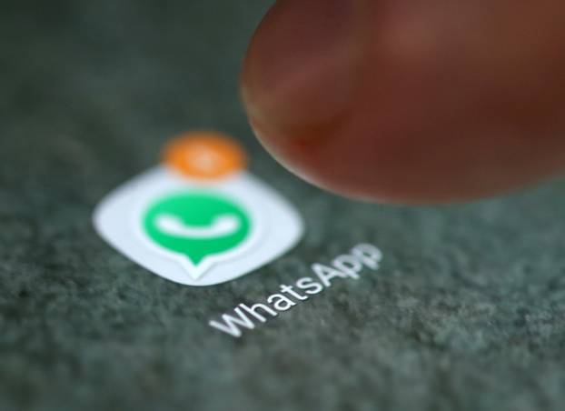 FILE PHOTO: The WhatsApp app logo is seen on a smartphone in this illustration