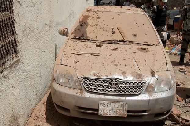 A damaged car is seen after a suicide bomber blew himself up in Mecca, Saudi Arabia