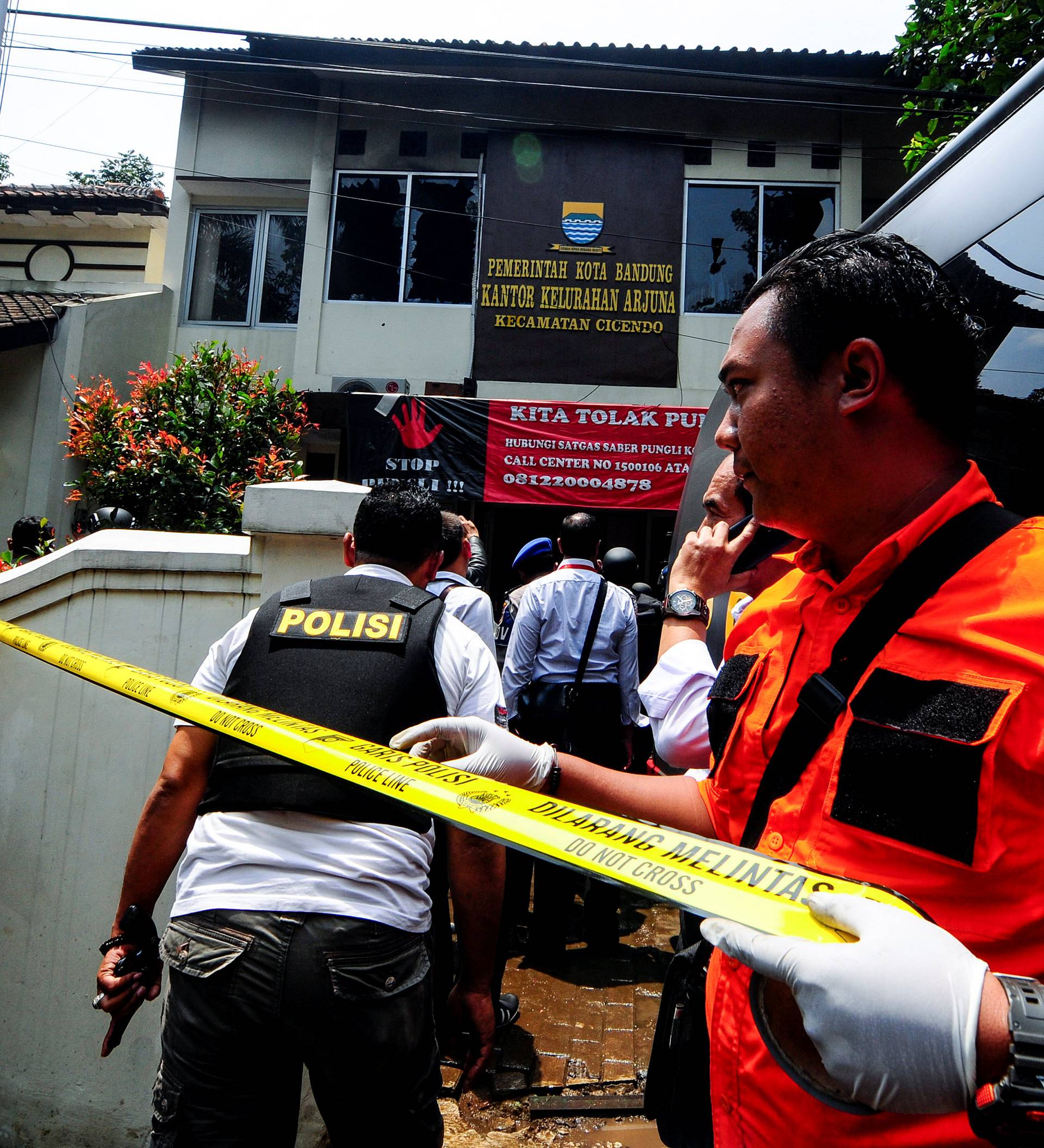 Police secure the area around  a local government office following an explosion in Bandung, West Java, Indonesia