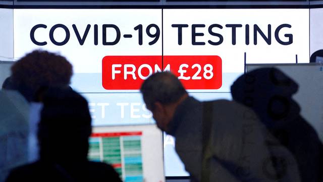 FILE PHOTO: Customers are seen inside a private COVID-19 testing clinic in a busy shopping area, amid the coronavirus disease (COVID-19) outbreak in London