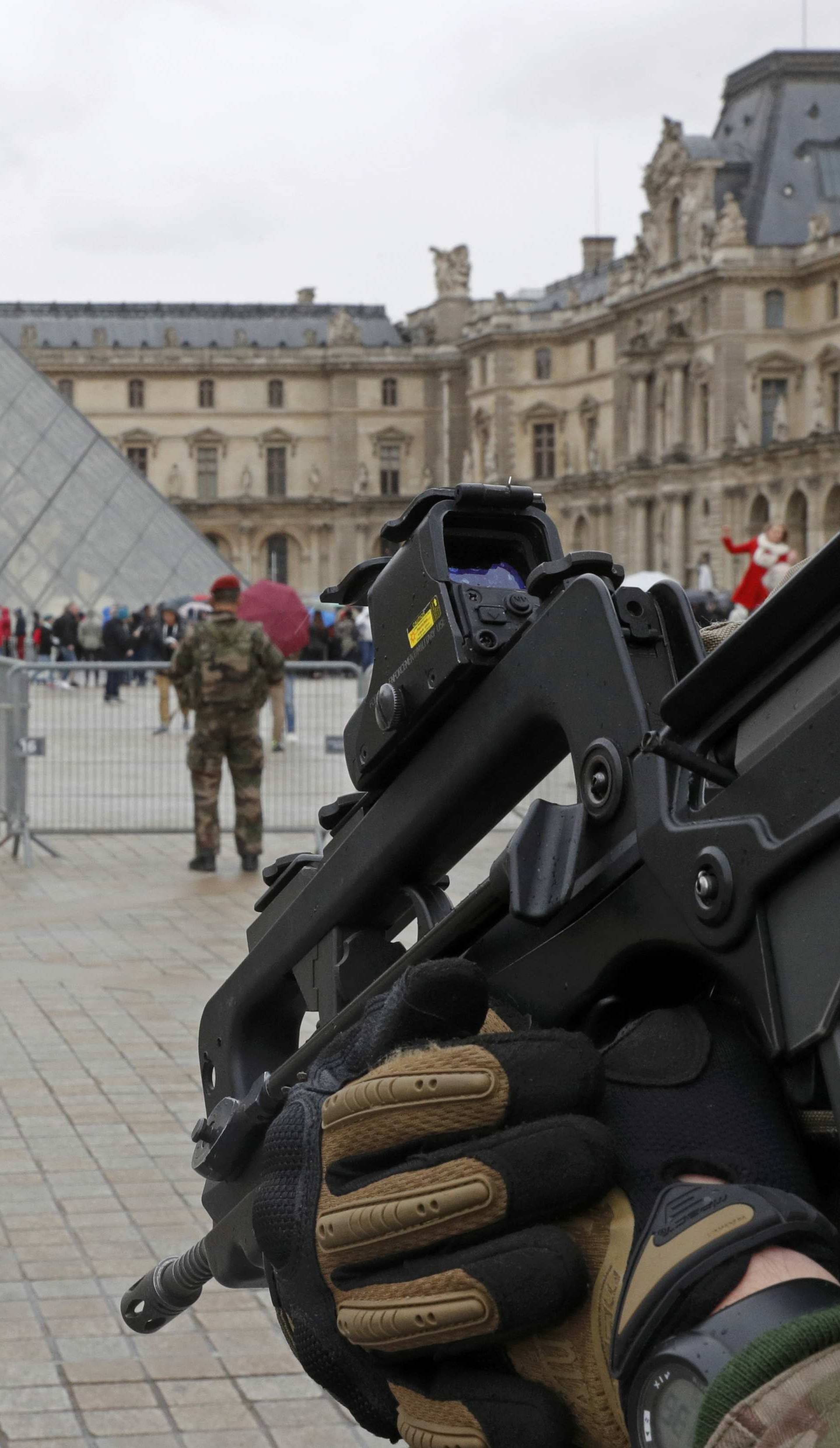 FILE PHOTO - French army paratroopers patrol near the Louvre museum in Paris