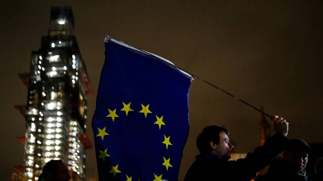 An anti-Brexit protester demonstrates outside the Houses of Parliament in London