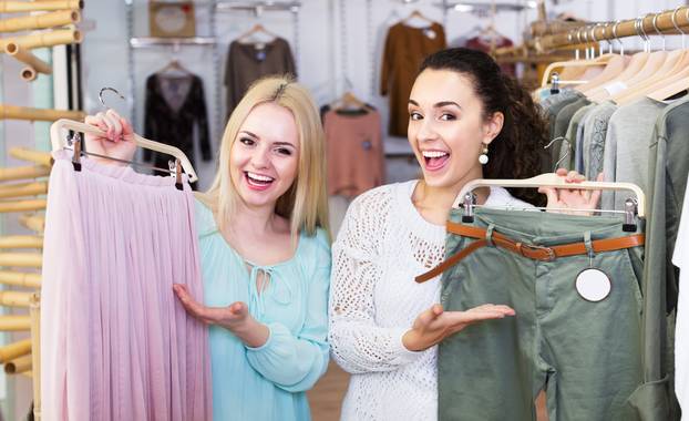 Two girls choosing clothes