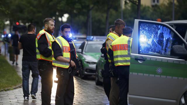 Police secure a street near to the scene of a shooting in Munich