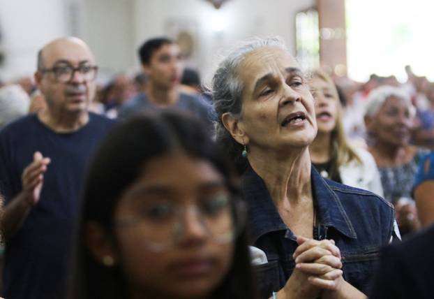 People attend Mass during a national day of prayer, following earthquakes in Valencia