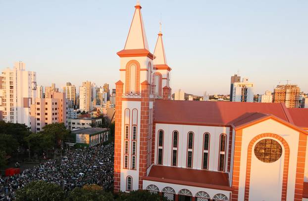 Fans of Chapecoense soccer team gather in the streets to pay tribute to their players in Chapeco