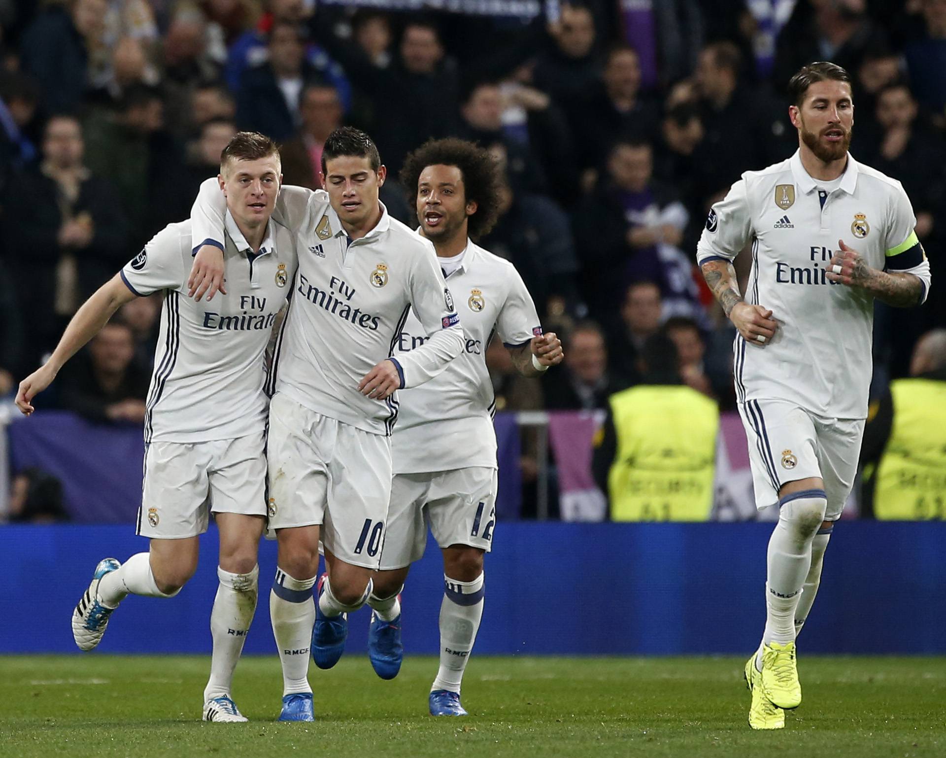Real Madrid's Toni Kroos celebrates scoring their second goal with James Rodriguez