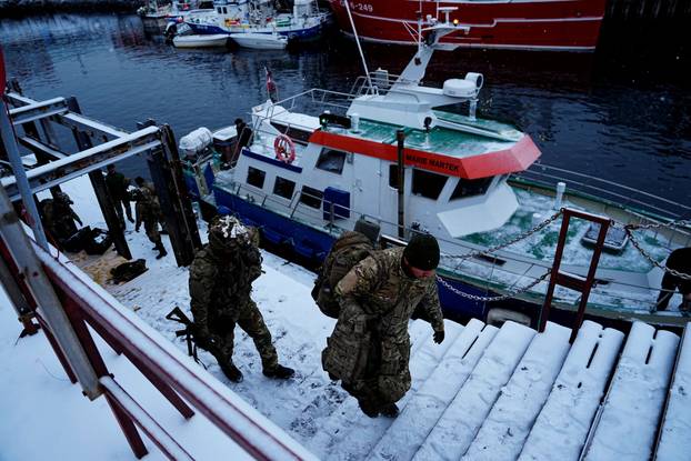Danish soldiers disembark at the port in Nuuk