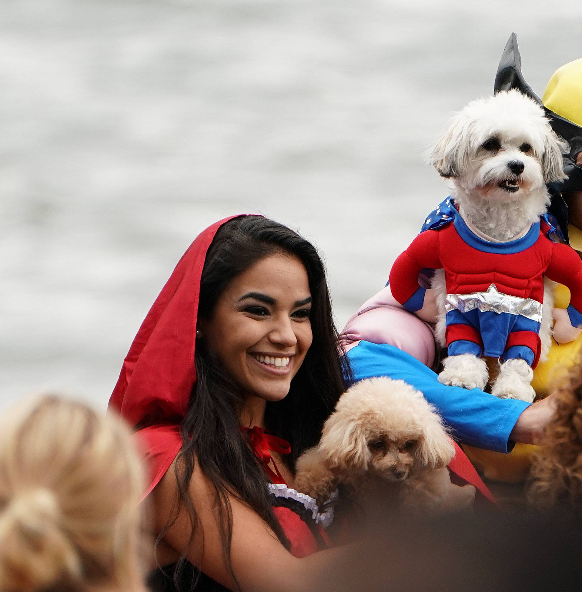 People attend the Tompkins Square Park Halloween Dog Parade at East River Park in the Manhattan borough of New York City
