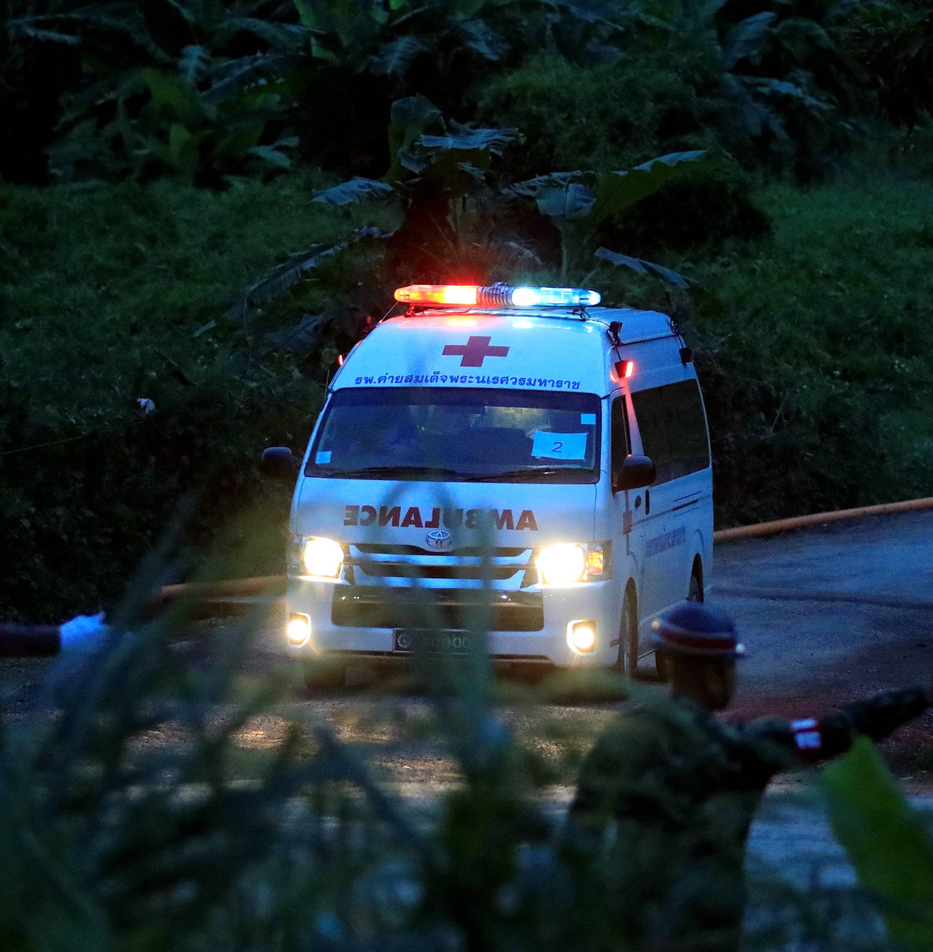 An ambulance leaves from Tham Luang cave complex in the northern province of Chiang Rai