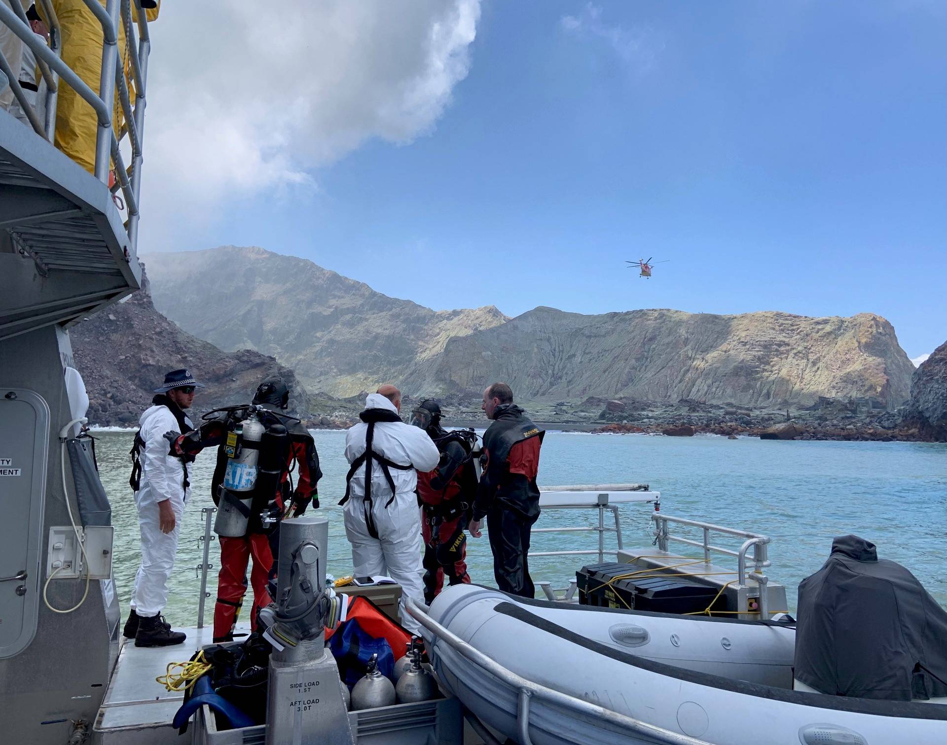 Members of a dive squad conduct a search during a recovery operation around White Island, which is also known by its Maori name of Whakaari, a volcanic island that fatally erupted earlier this week, in New Zealand