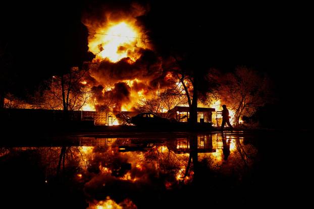 Rescuers work at the site of a Russian missile strike, amid Russia's attack on Ukraine, in Kyiv