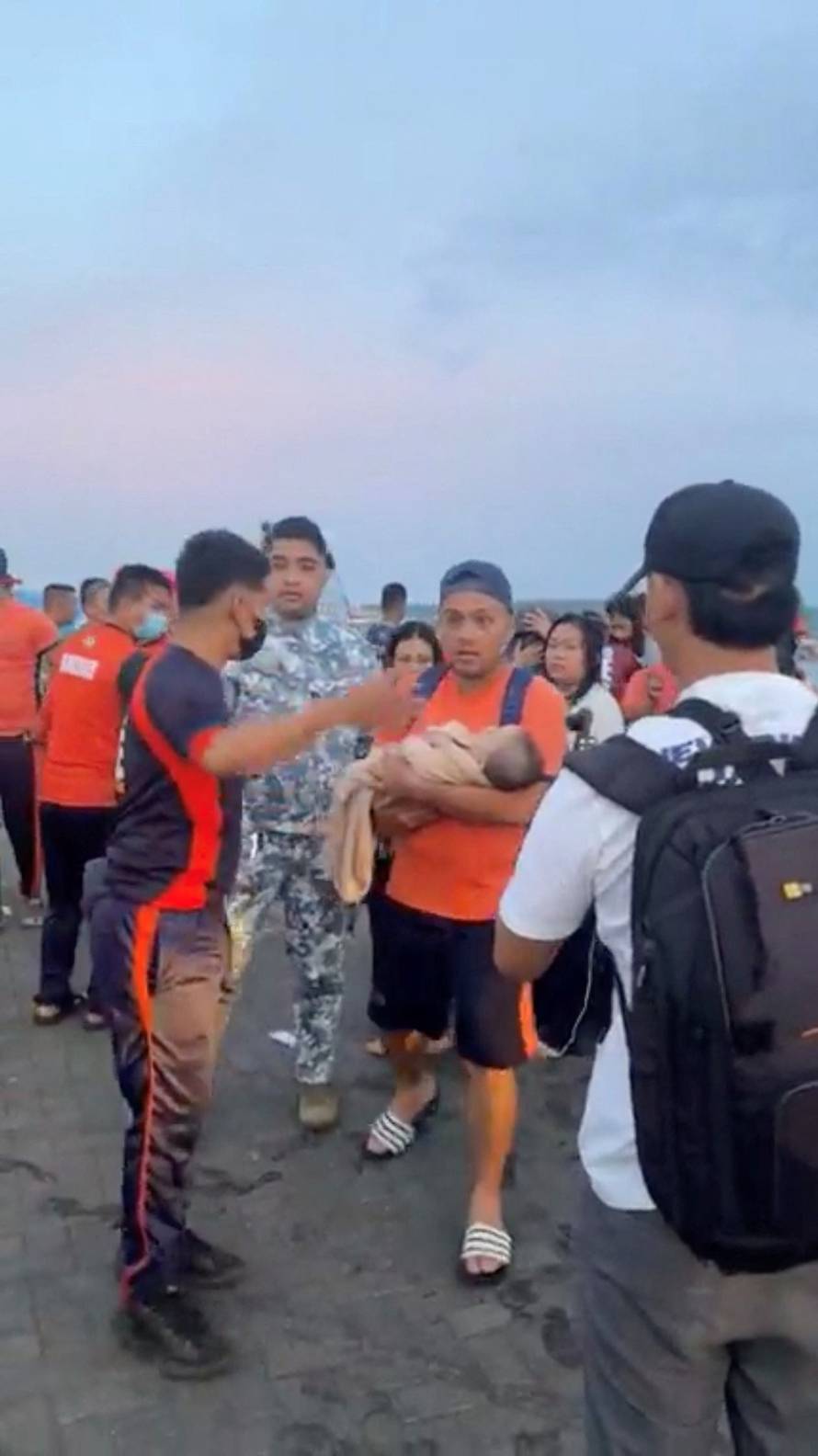 Emergency operations as victims of ferry capsize arrive in southern Philippines port