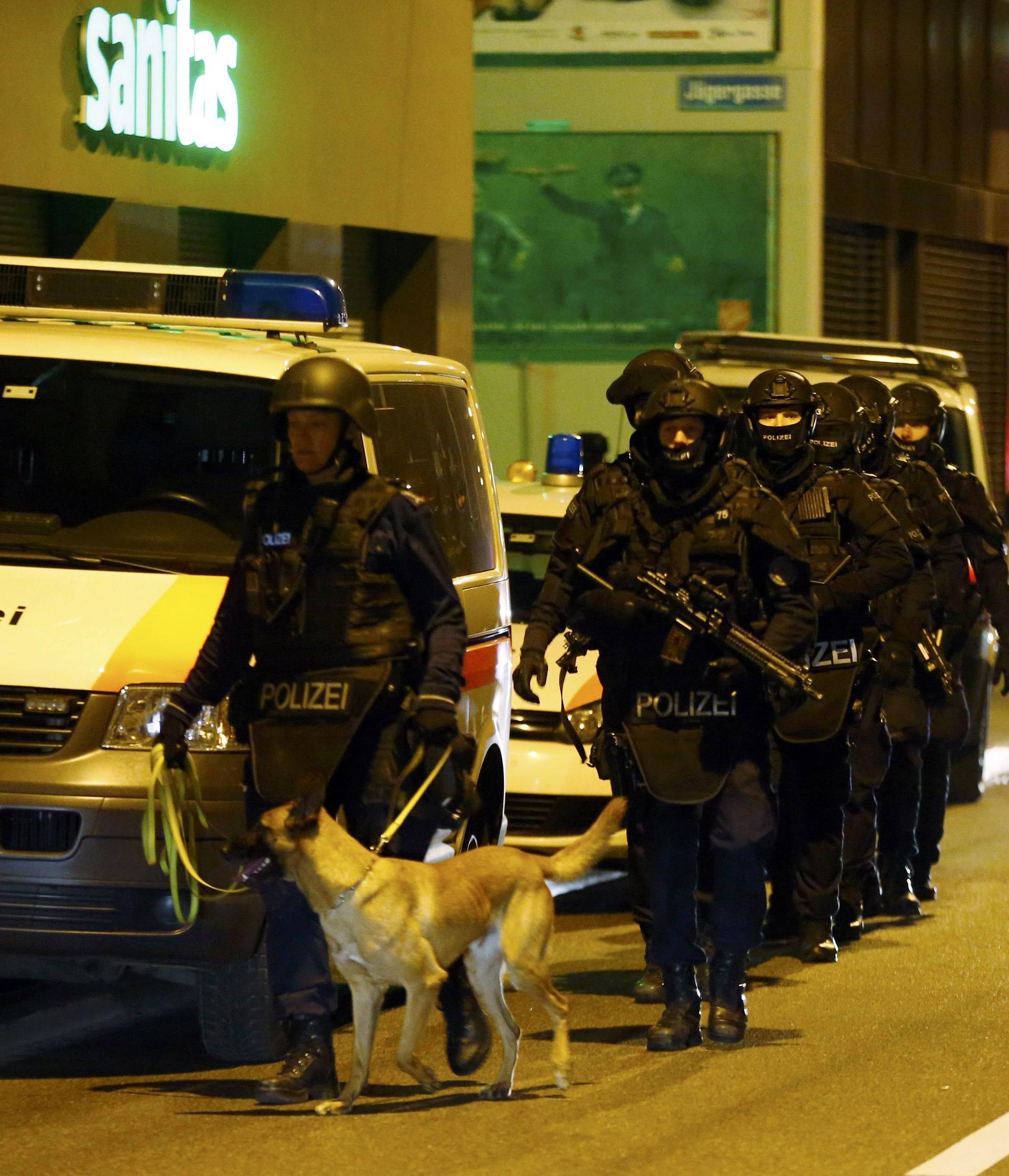 Police stand outside an Islamic center in central Zurich