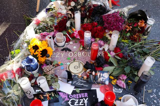 Flowers and pictures are placed on the star of late Ozzy Osbourne at the Hollywood Walk of Fame in Los Angeles