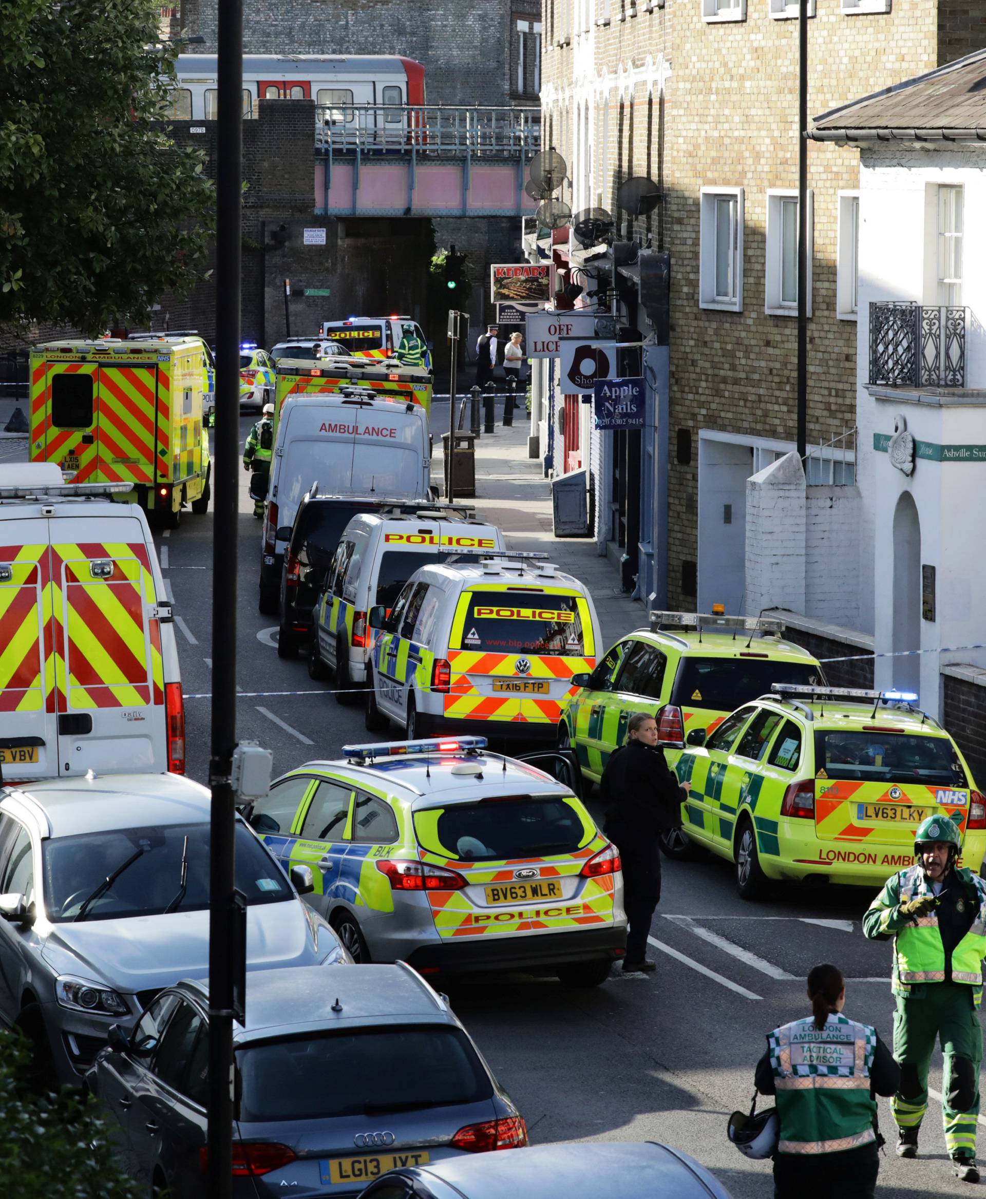 Police vehicles line the street near Parsons Green tube station in London