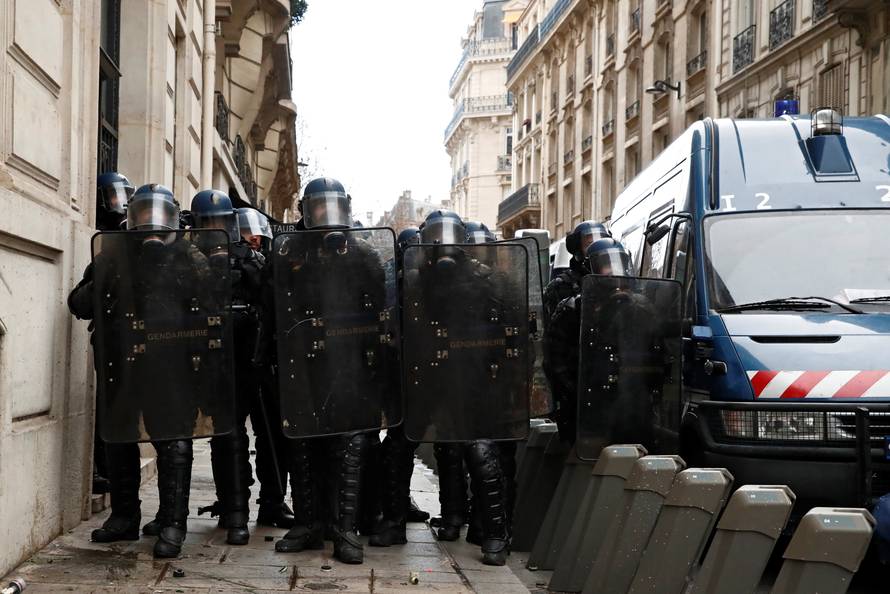 French gendarmes secure a street during a national day of protest by the "yellow vests" movement in Paris