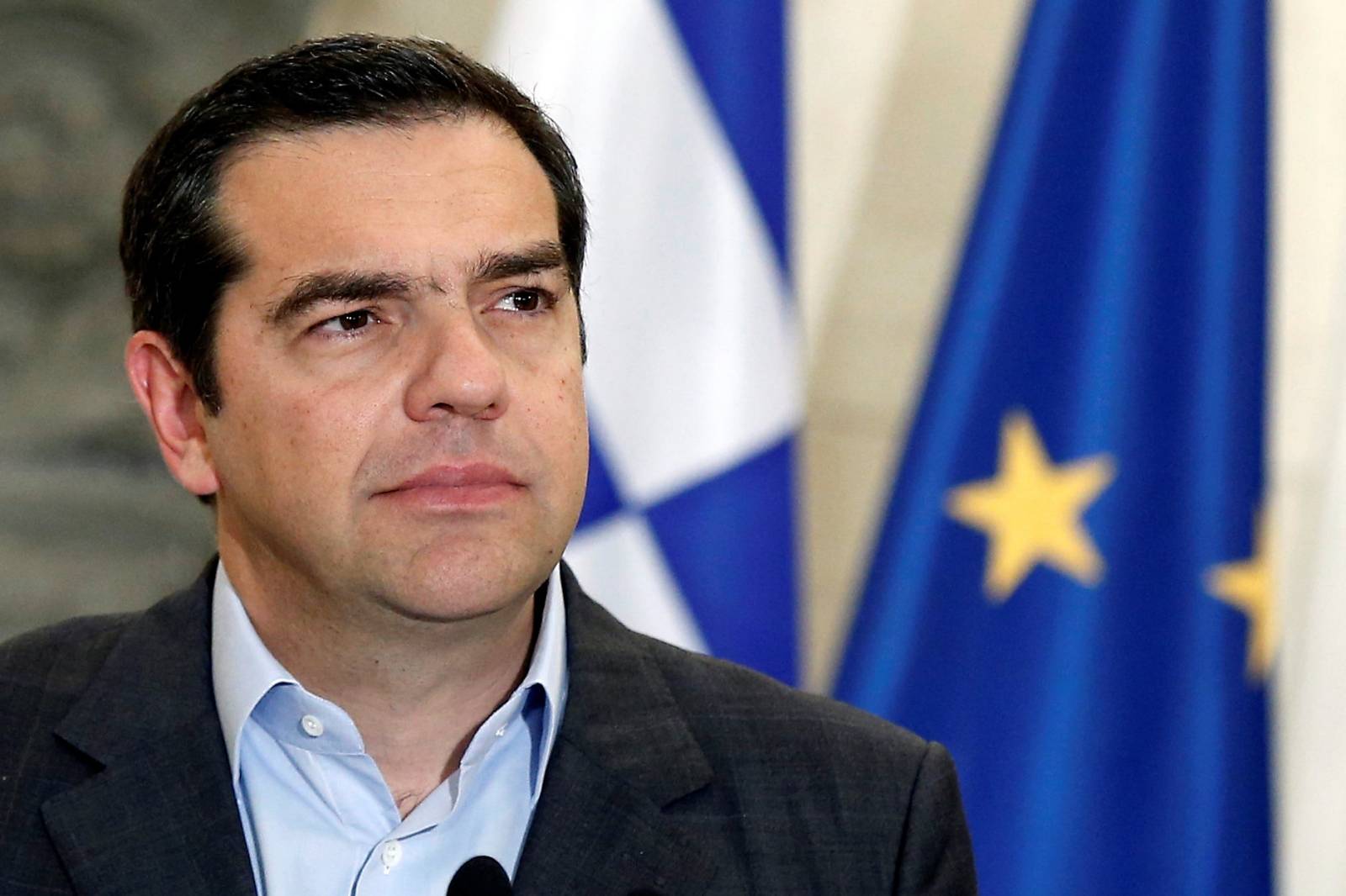 Greek Prime Minister Alexis Tsipras attends joint statements with his Danish counterpart Lars Loekke Rasmussen after their meeting at the Maximos Mansion in Athens