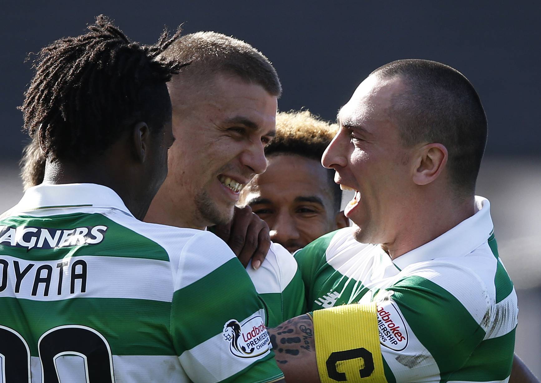 Celtic's Jozo Simunovic celebrates scoring their first goal with Dedryck Boyata and Scott Brown