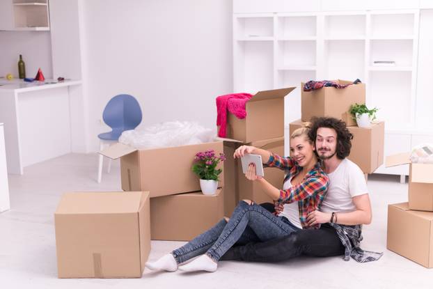 young couple moving  in new house