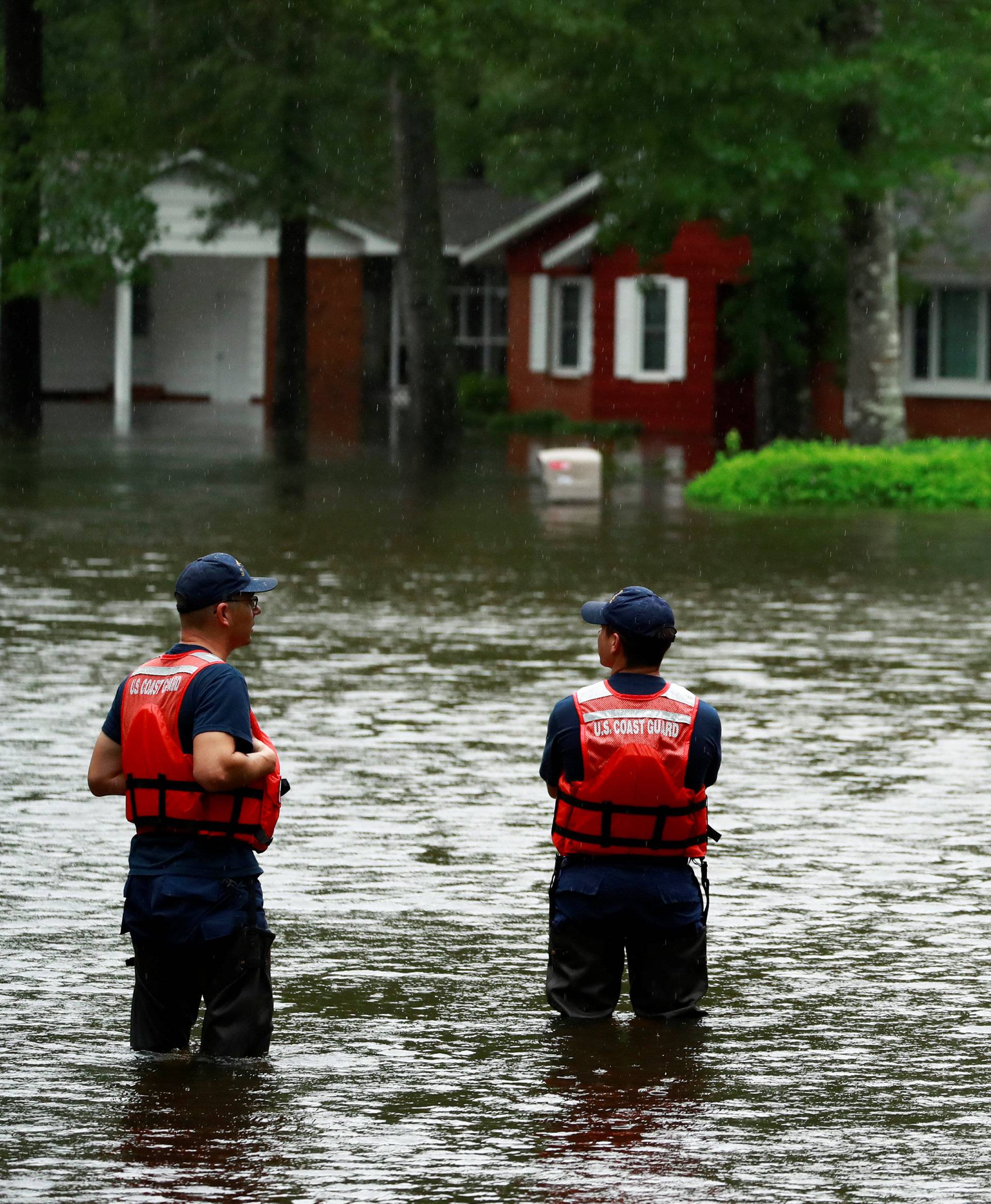 Coast Guard members inspect the flood waters caused by Hurricane Florence in Lumberton.