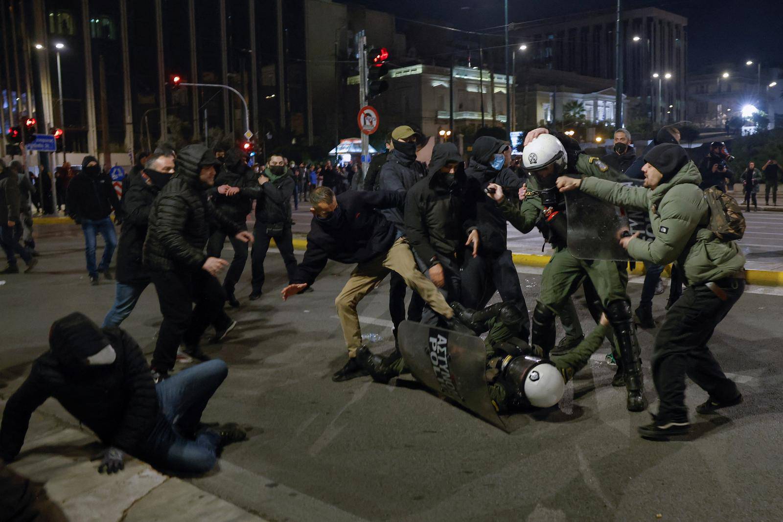 Protesters clash with police during a demonstration after a train crash near the city of Larissa, in Athens