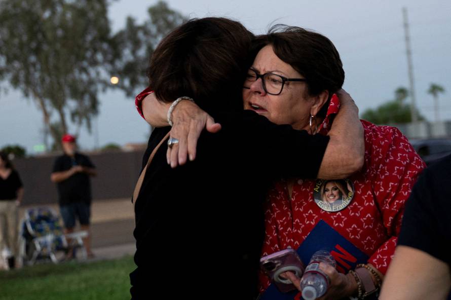 Catholics from across the Phoenix area gather to pray for Charlie Kirk, who was shot and killed in Utah, at Desert Horizon Park in Scottsdale