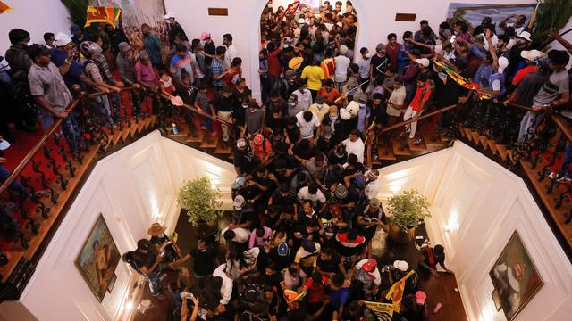 Demonstrators protest inside the President's House, after President Gotabaya Rajapaksa fled, in Colombo