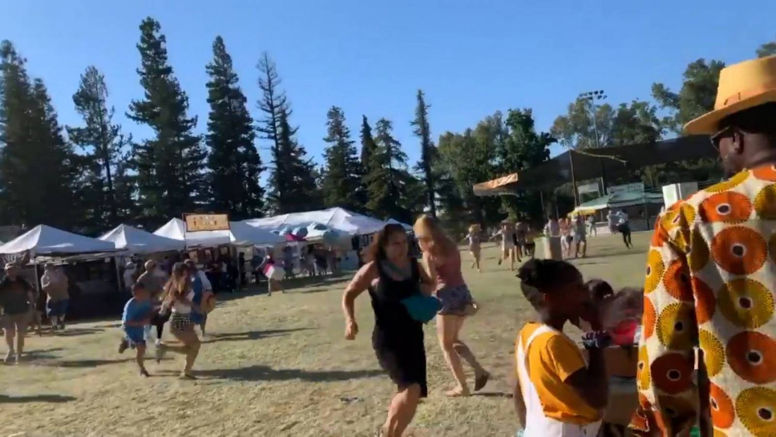 Social media video grab of people running away as an active shooter was reported at the Gilroy Garlic Festival, south of San Jose, California