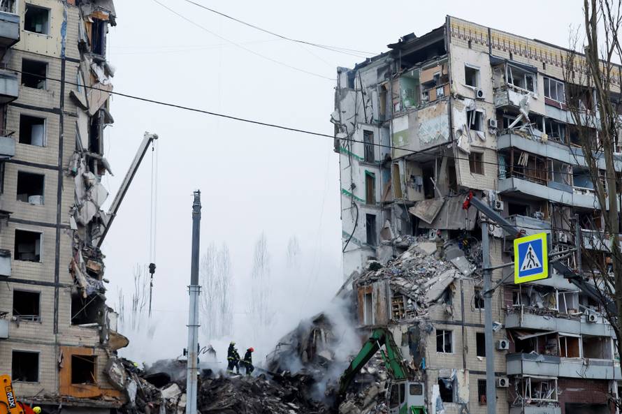 Aftermath of Dnipro apartment block destruction following missile strike
