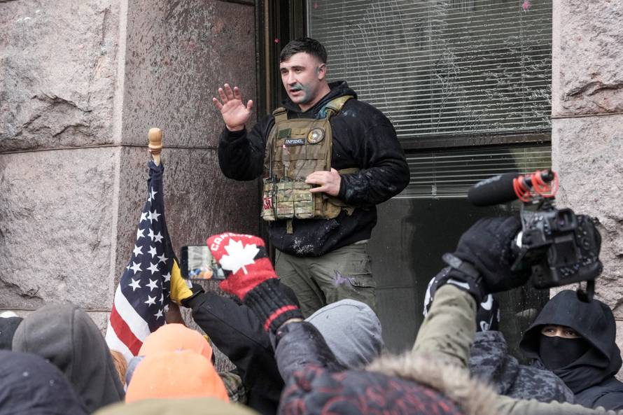 People attend the "March Against Minnesota Fraud" in Minneapolis