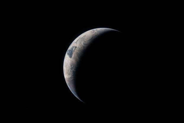 View of Earth taken by an Artemis II crew member through the window of the Orion spacecraft