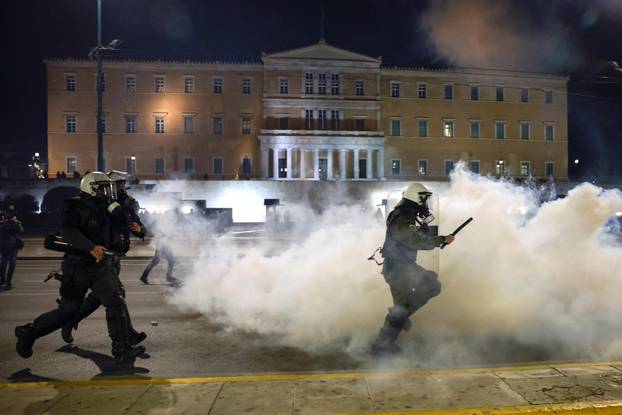 Protesters clash with police during a demonstration after a train crash near the city of Larissa, in Athens