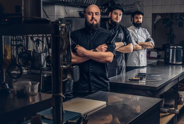 Team,Of,Professional,Bearded,Cooks,Dressed,In,Uniforms,Posing,With