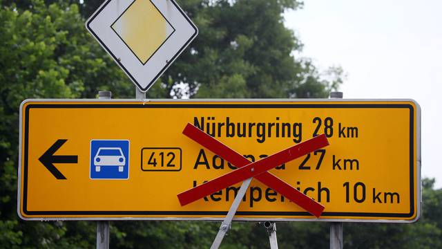 A street to the Nuerburgring German Formula One race track hosting the open-air weekend "Rock am Ring" concert is blocked by police near Nuerburgring
