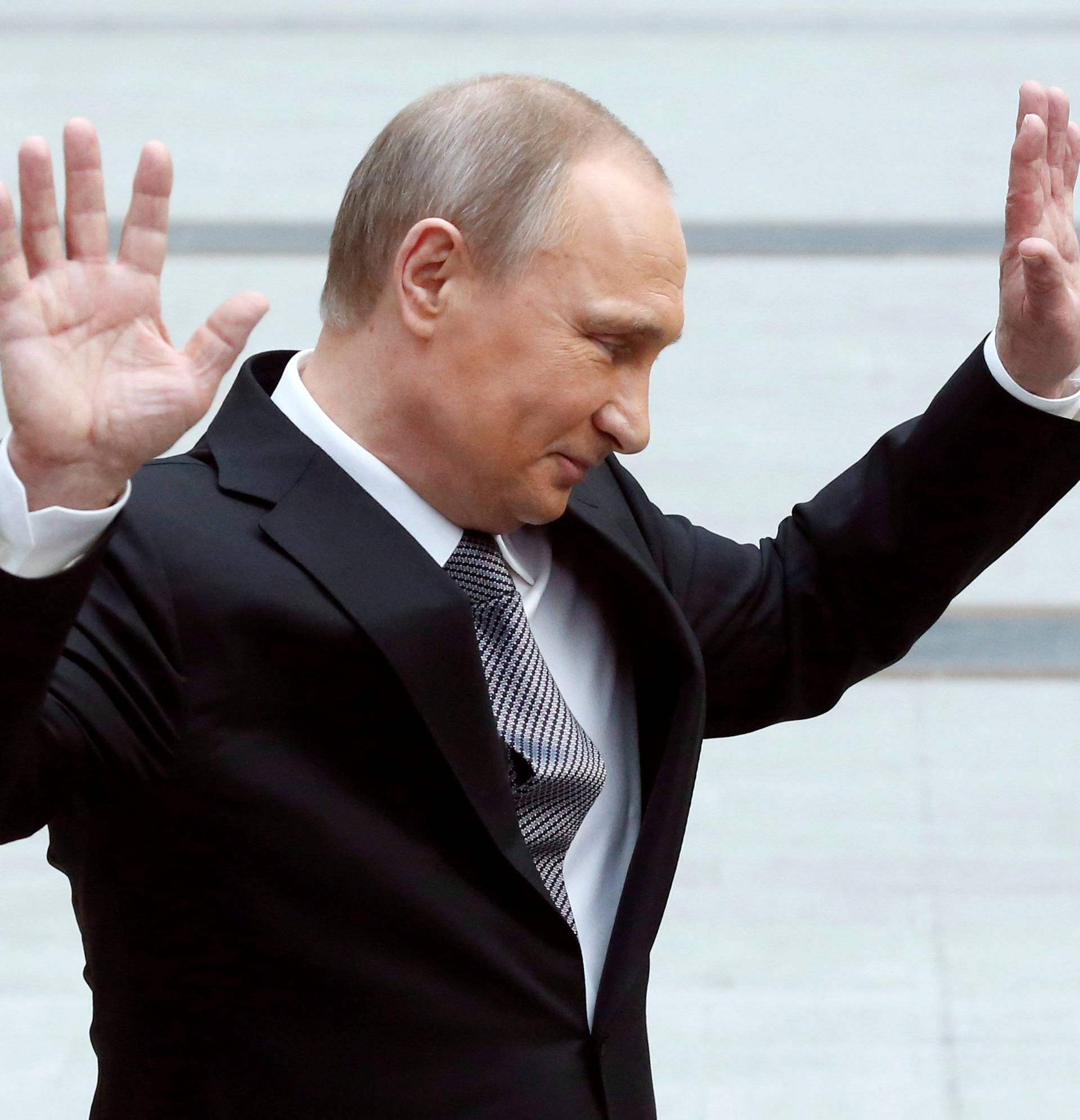 Russian President Vladimir Putin gestures during a meeting with journalists after a live broadcast nationwide call-in in Moscow