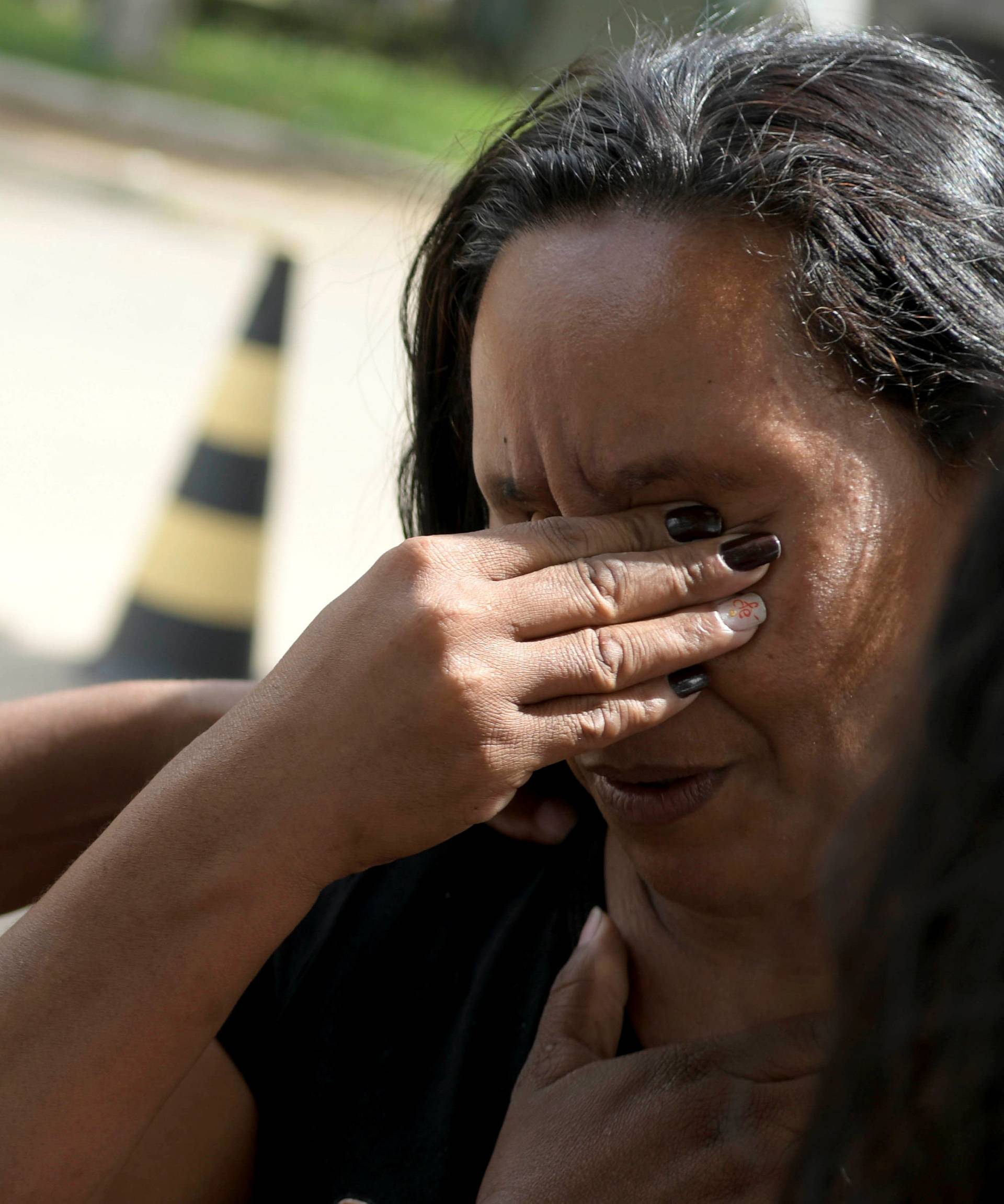 Relatives of people affected by a burst tailings dam owned by Brazilian miner Vale SA react, in Brumadinho