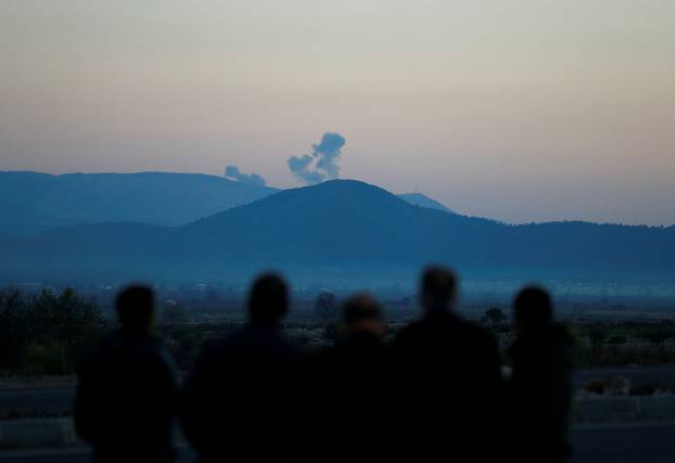 Smoke rises from the Syria