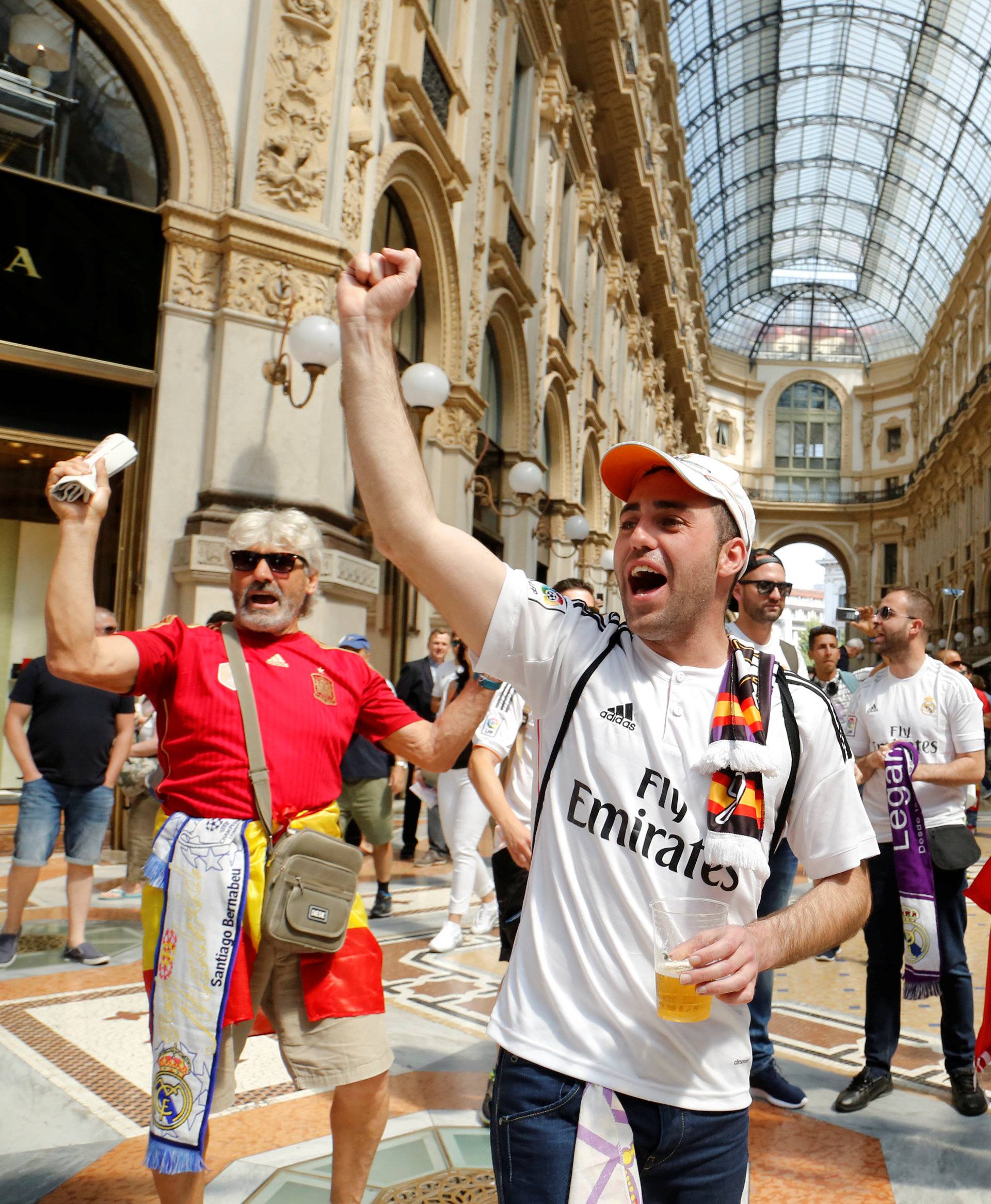 Real Madrid fans shout slogans before the Champions League Final between Real Madrid and Atletico Madrid in Milan