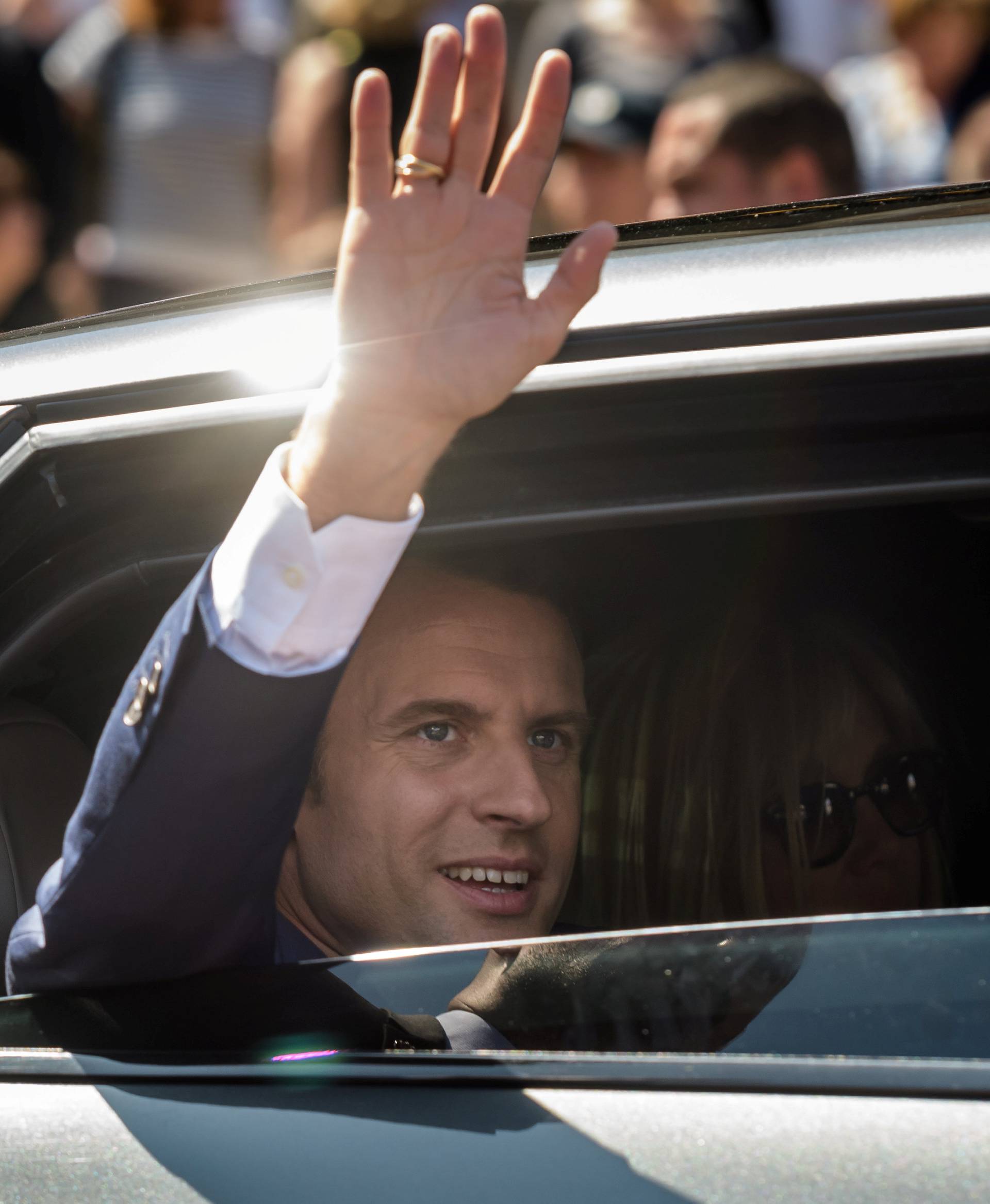 French President Emmanuel Macron leaves polling station after voting in parliamentary elections in Le Touquet