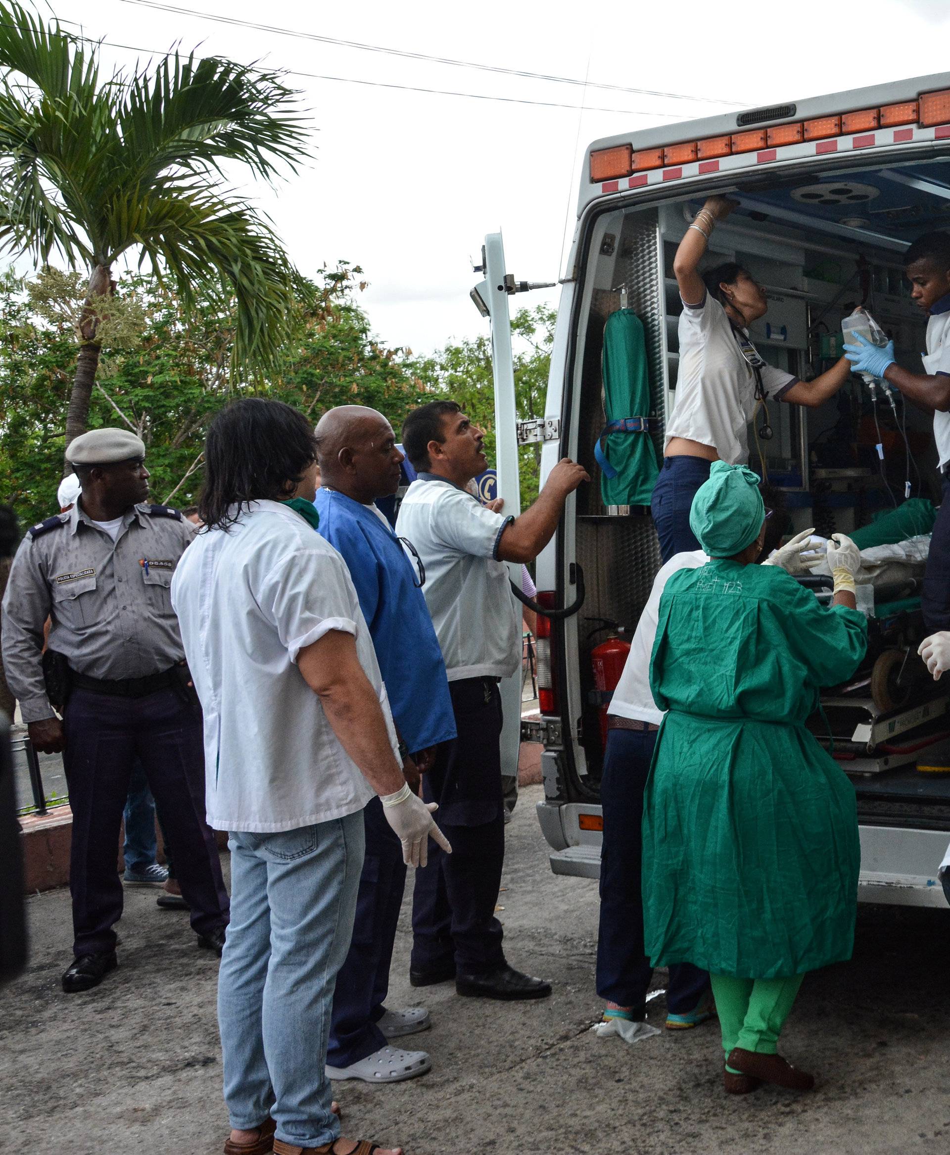 A survivor of a Boeing 737 plane that crashed in the agricultural area of Boyeros shortly after taking off from Havana's main airport receives medical care