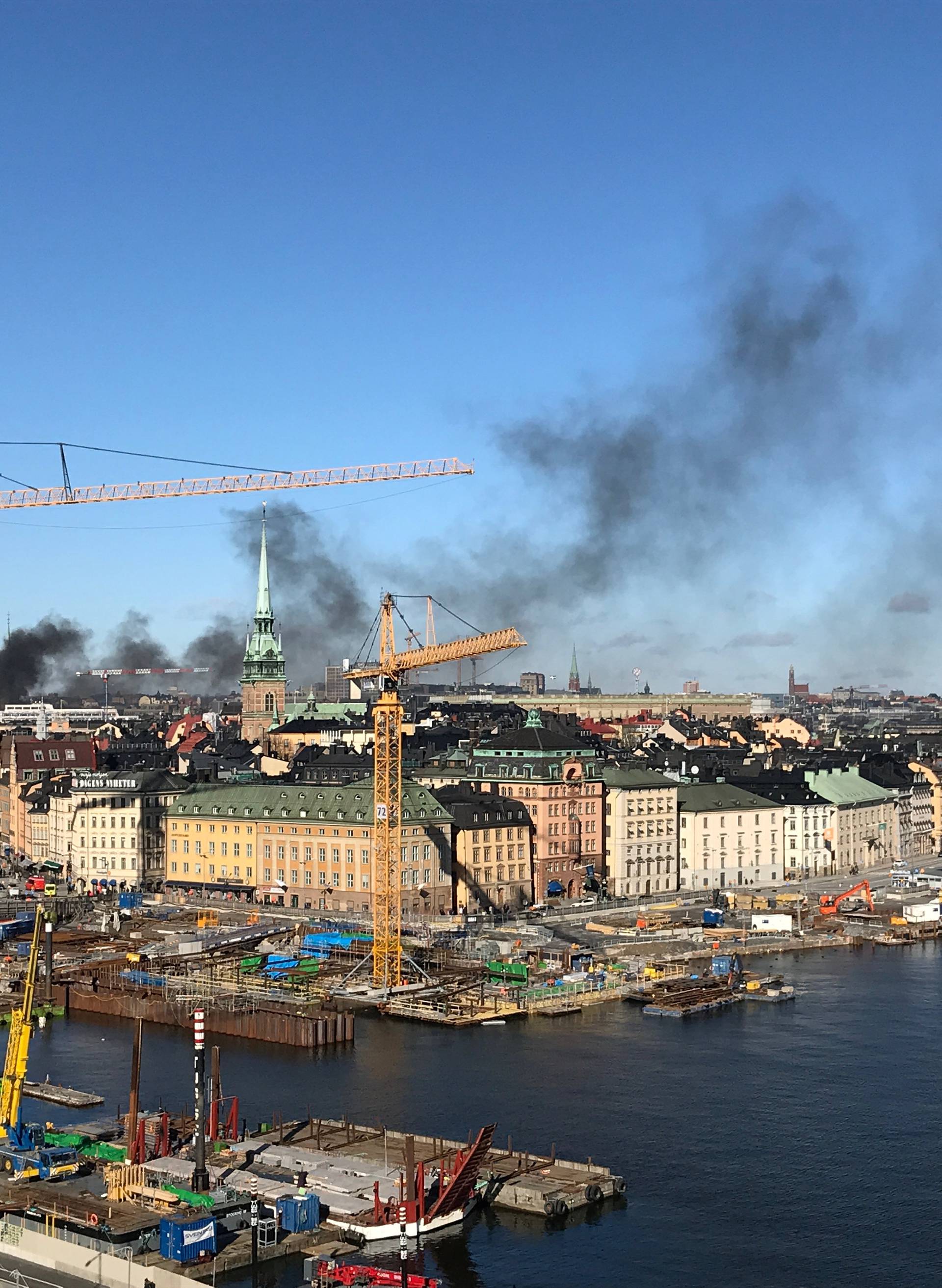 Smoke from a bus explosion and fire is seen in Tegelbacken in central Stockholm