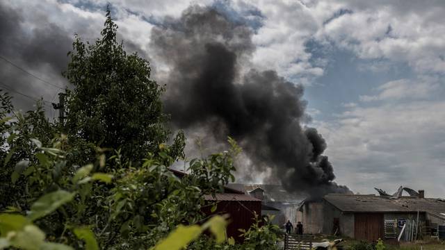 A smoke rises after shelling near the Ukraine-Russia border in the town of Vovchansk